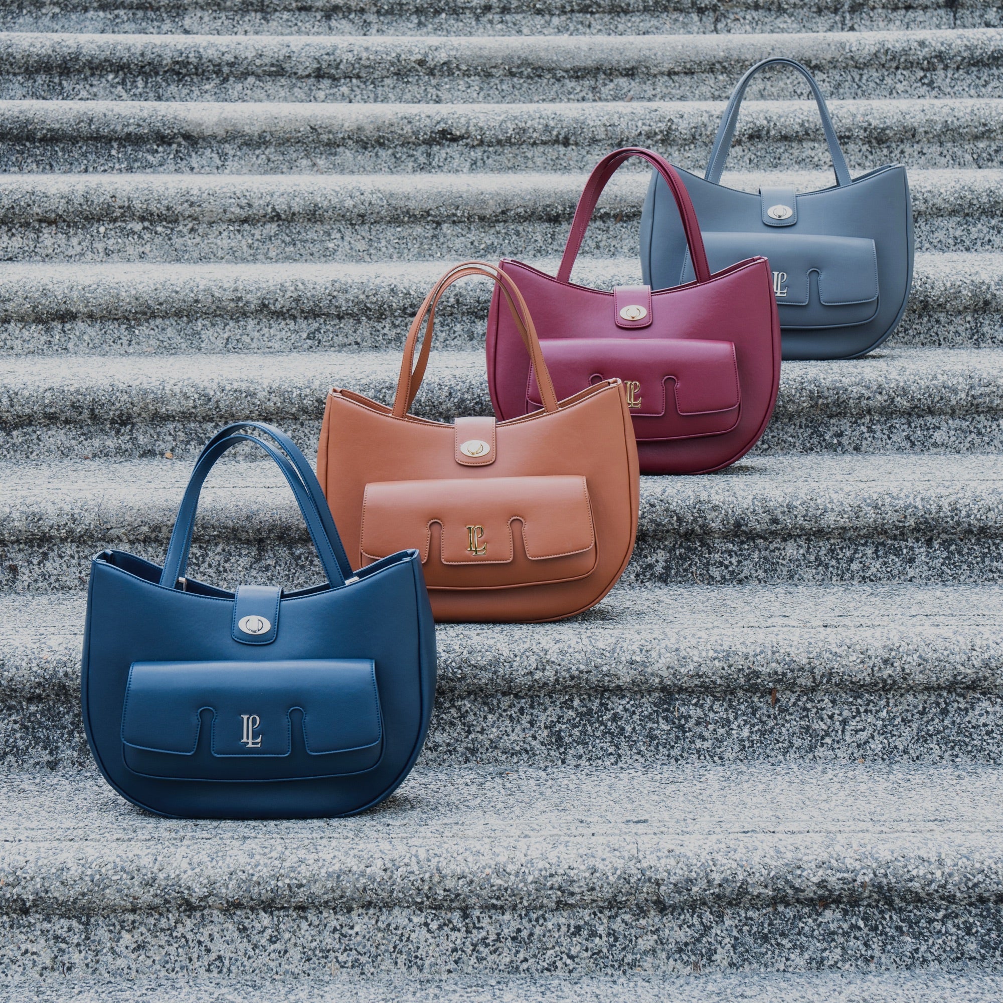 Four Levain bags on stone steps
